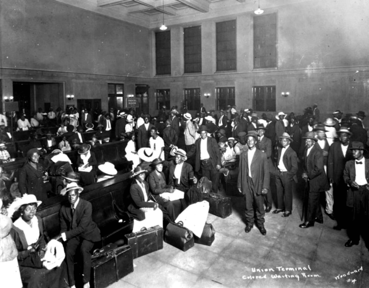 A segregated waiting room crowded with travelers at the Jacksonville railroad depot.