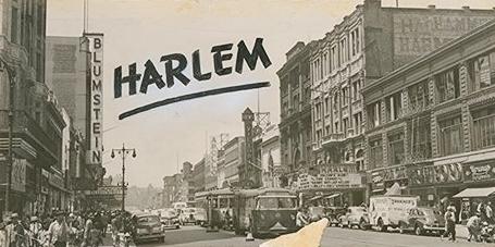 Black and white photo shows a crowded New York City street scene, with scores of people and vehicles in motion, notably a vintage streetcar as it approaches Seventh Ave. Signage on brownstone buildings on both sides of the street announce it as a bustling commercial thoroughfare. The name HARLEM appears in large, hand-inscribed black letters across the sky at the top of the photo.