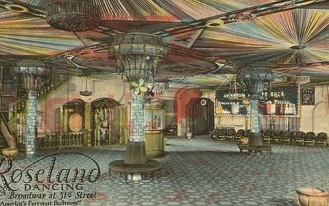 Colorful historic postcard of Roseland Ballroom, a dazzling dance floor with a ceiling of multicolored oval shapes and Art Deco floor furnishings. Three floor-to-ceiling flared columns of steel and glass hold up the ceiling. The floor itself is designed in the form of numerous bluish-gray linear strips that cover the entire ballroom.