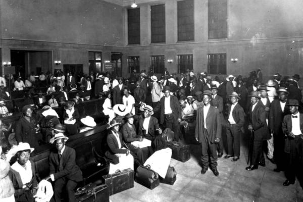 A segregated waiting room crowded with travelers at the Jacksonville railroad depot.